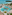 Luxury tropical resort pool, palm trees, sandy beach, and turquoise ocean.