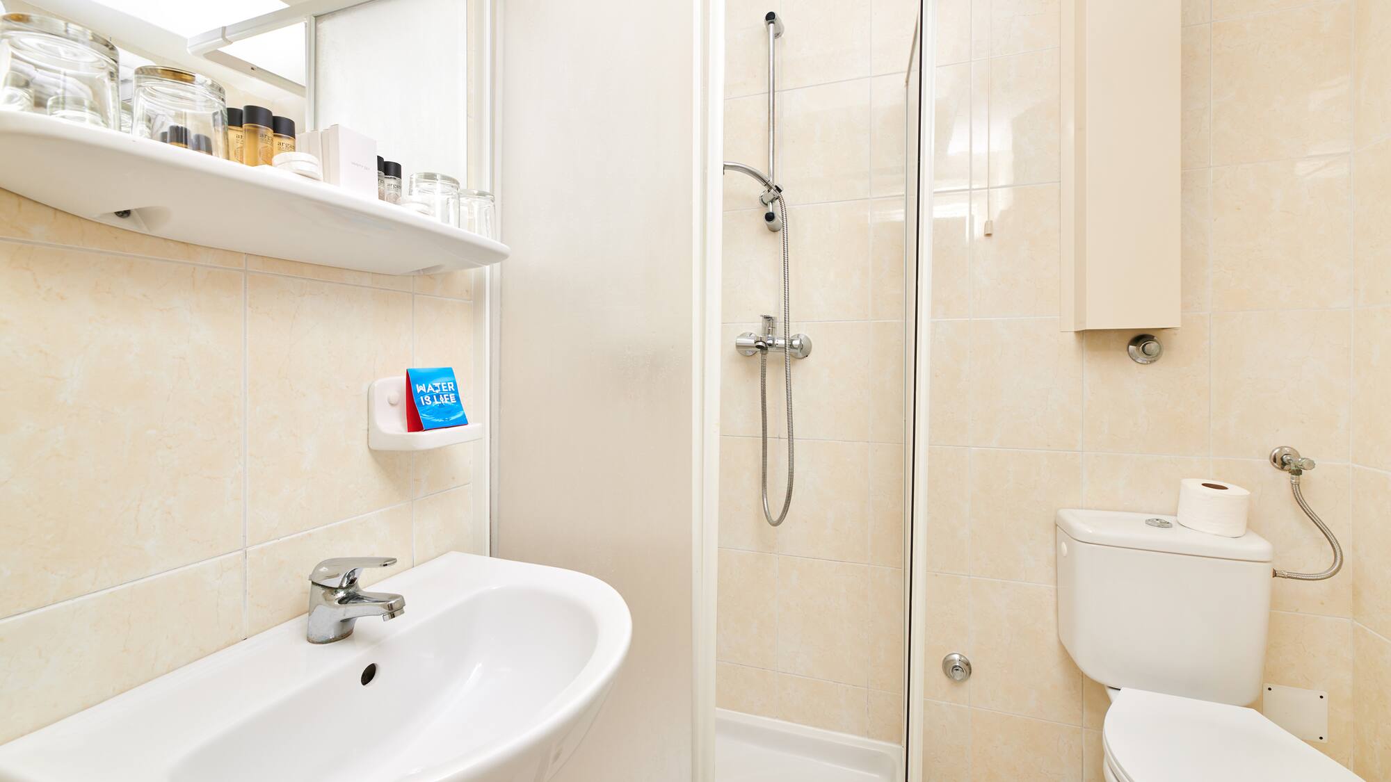 a bathroom with a shower and toilet