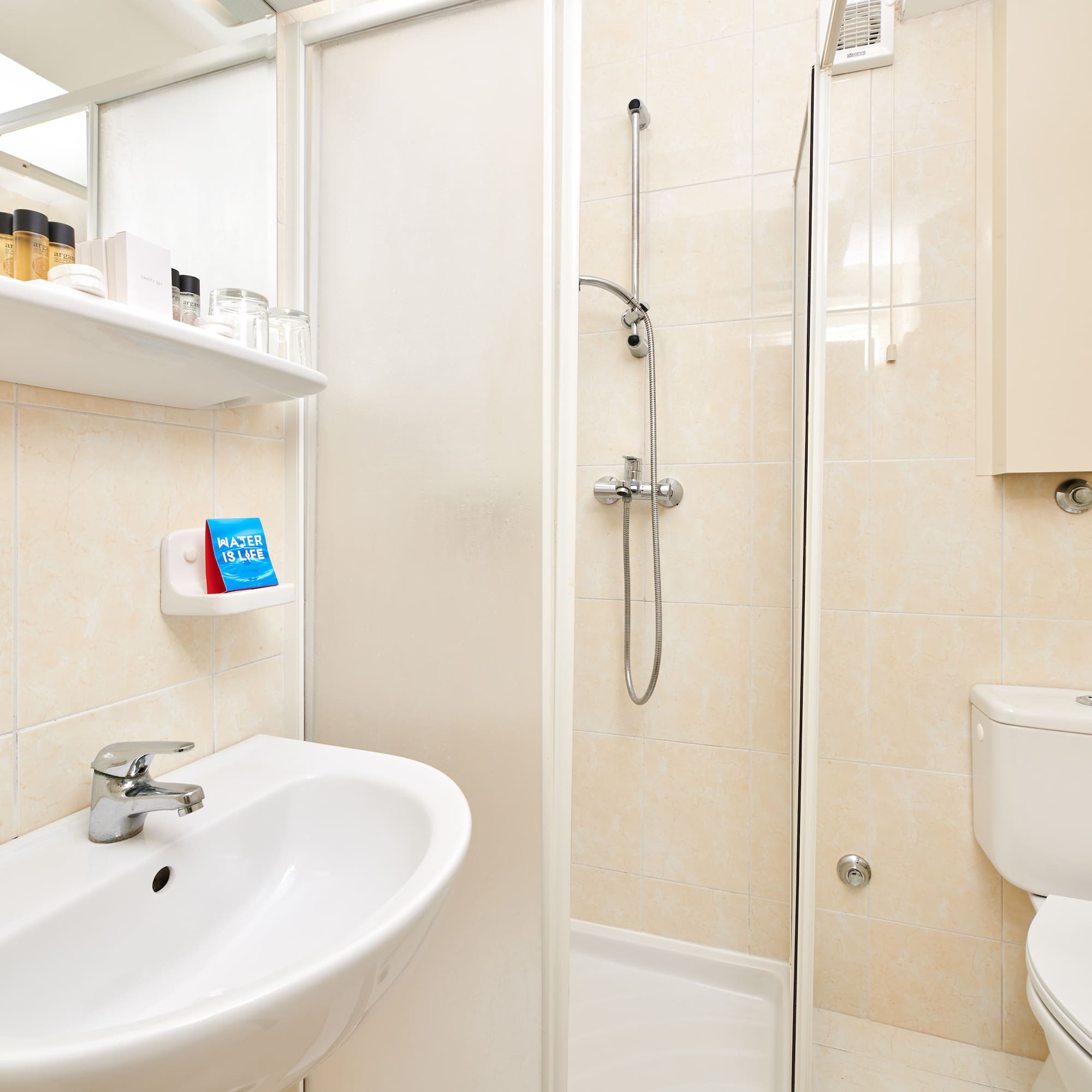 a bathroom with a shower and toilet