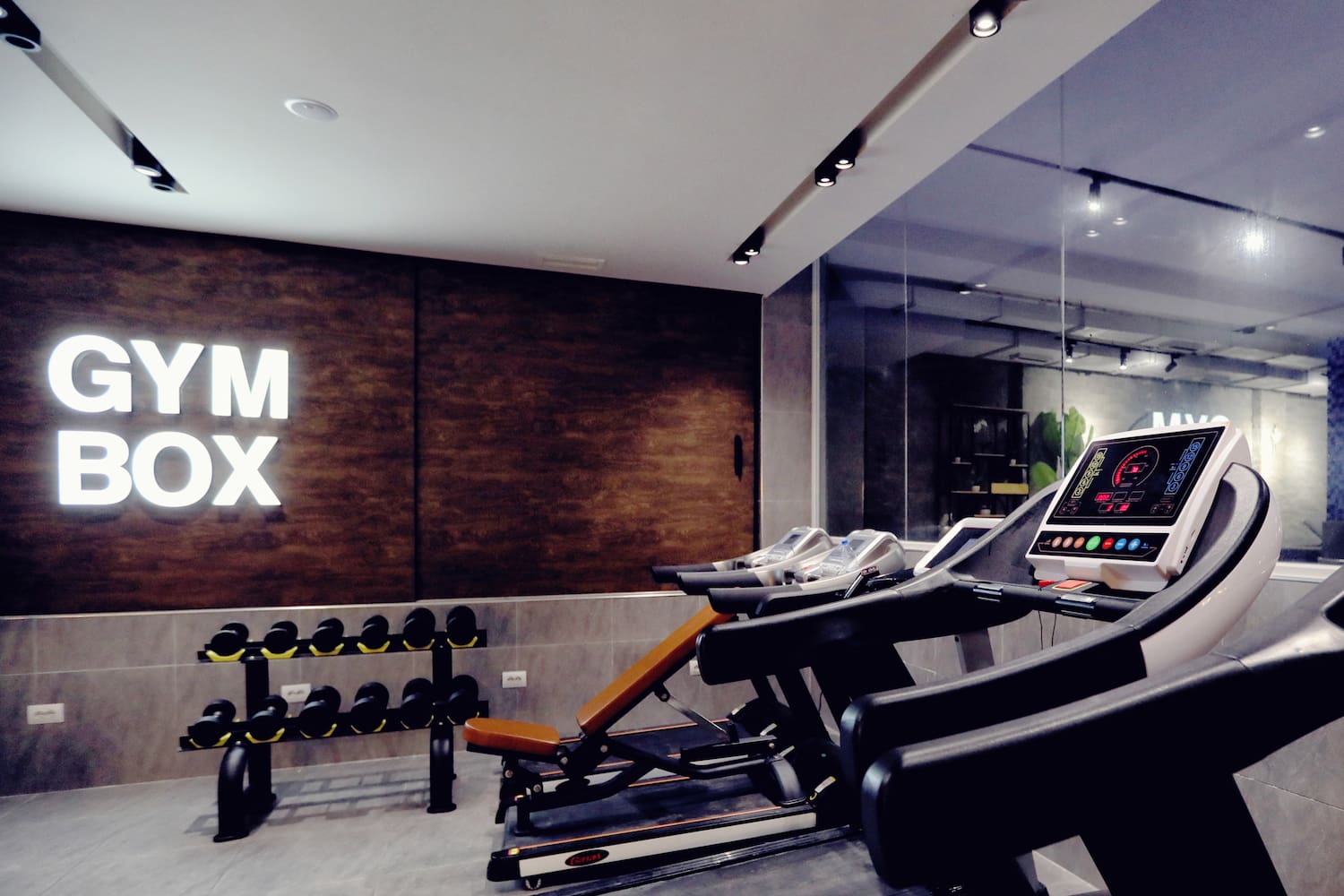 a room with treadmills and exercise equipment