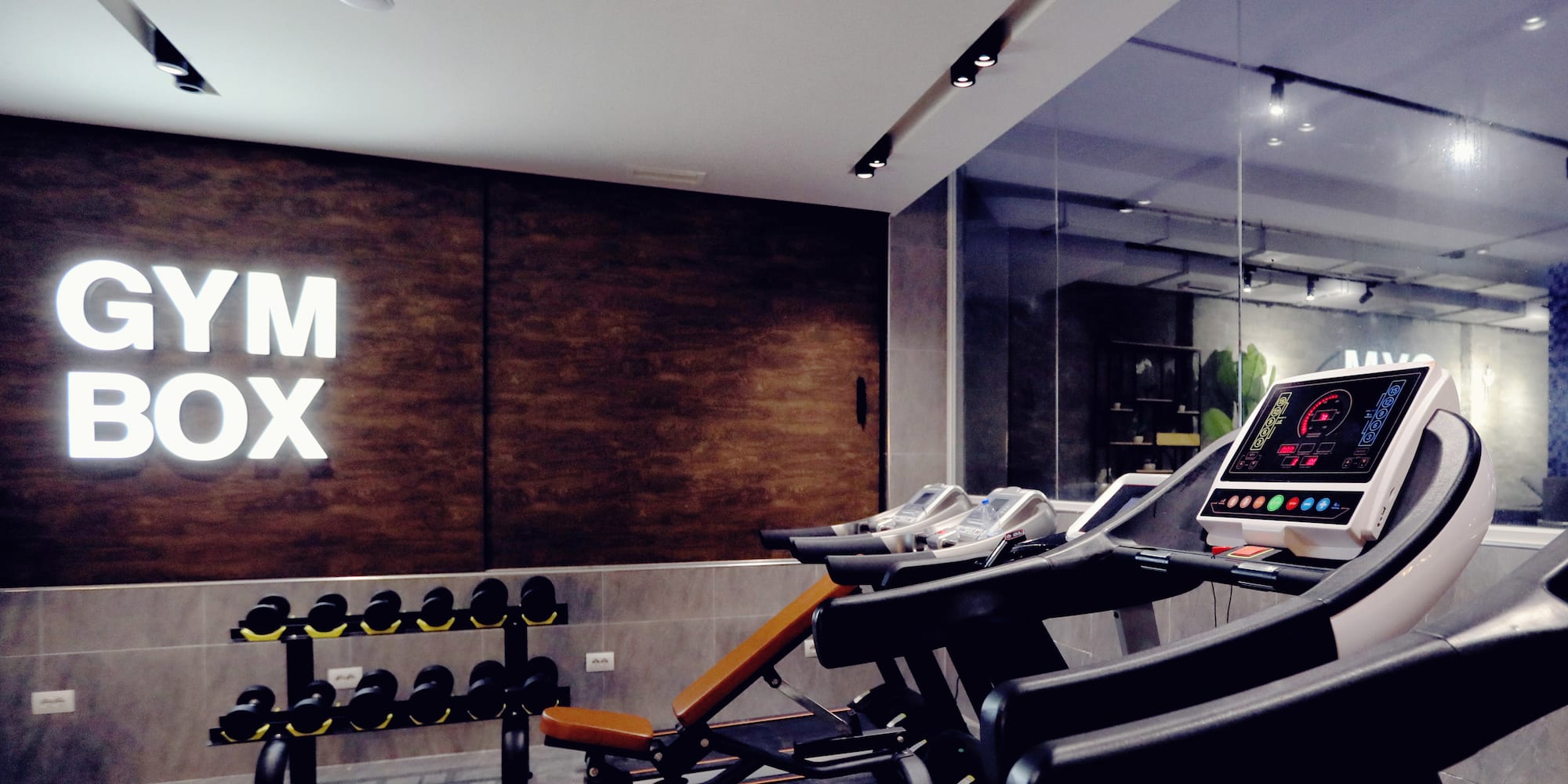 a room with treadmills and exercise equipment