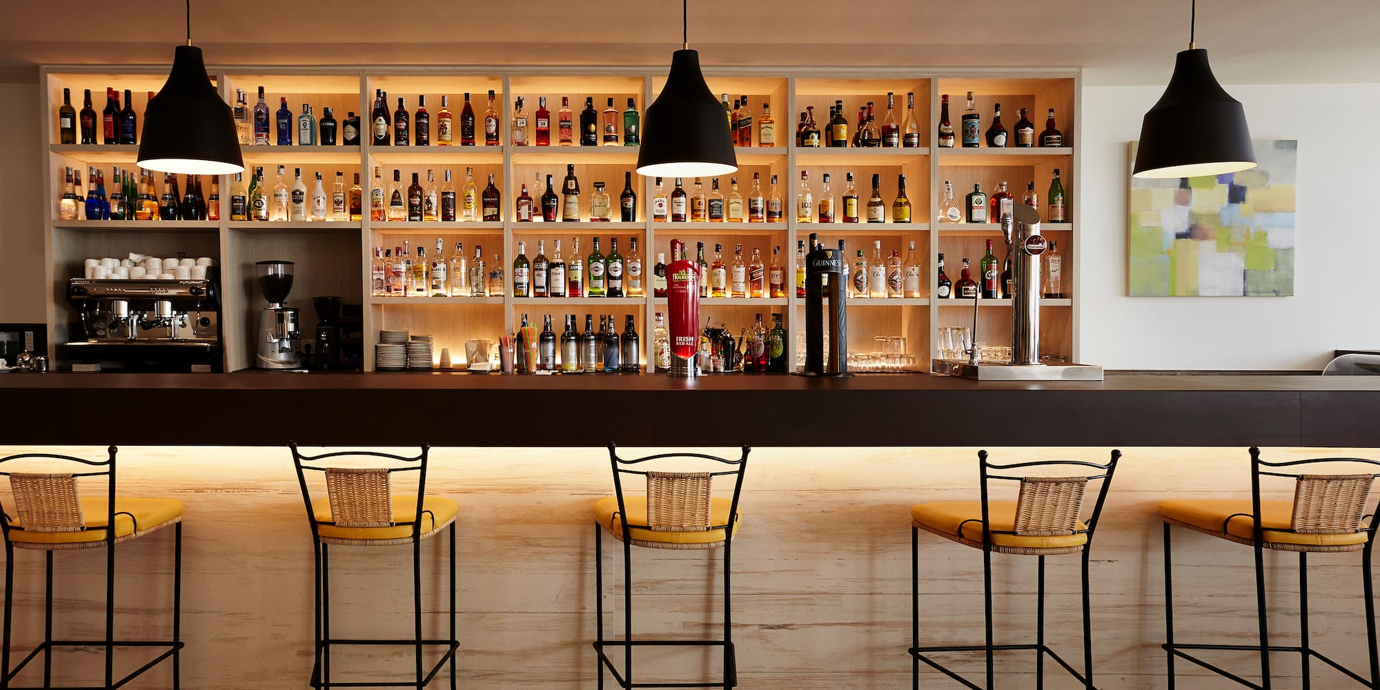 a bar with bottles on the shelves