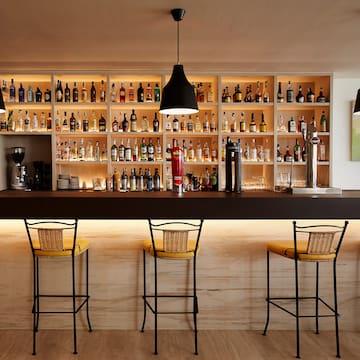 a bar with bottles on the shelves
