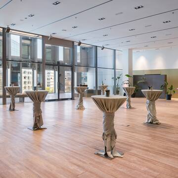 a room with tables covered with cloth