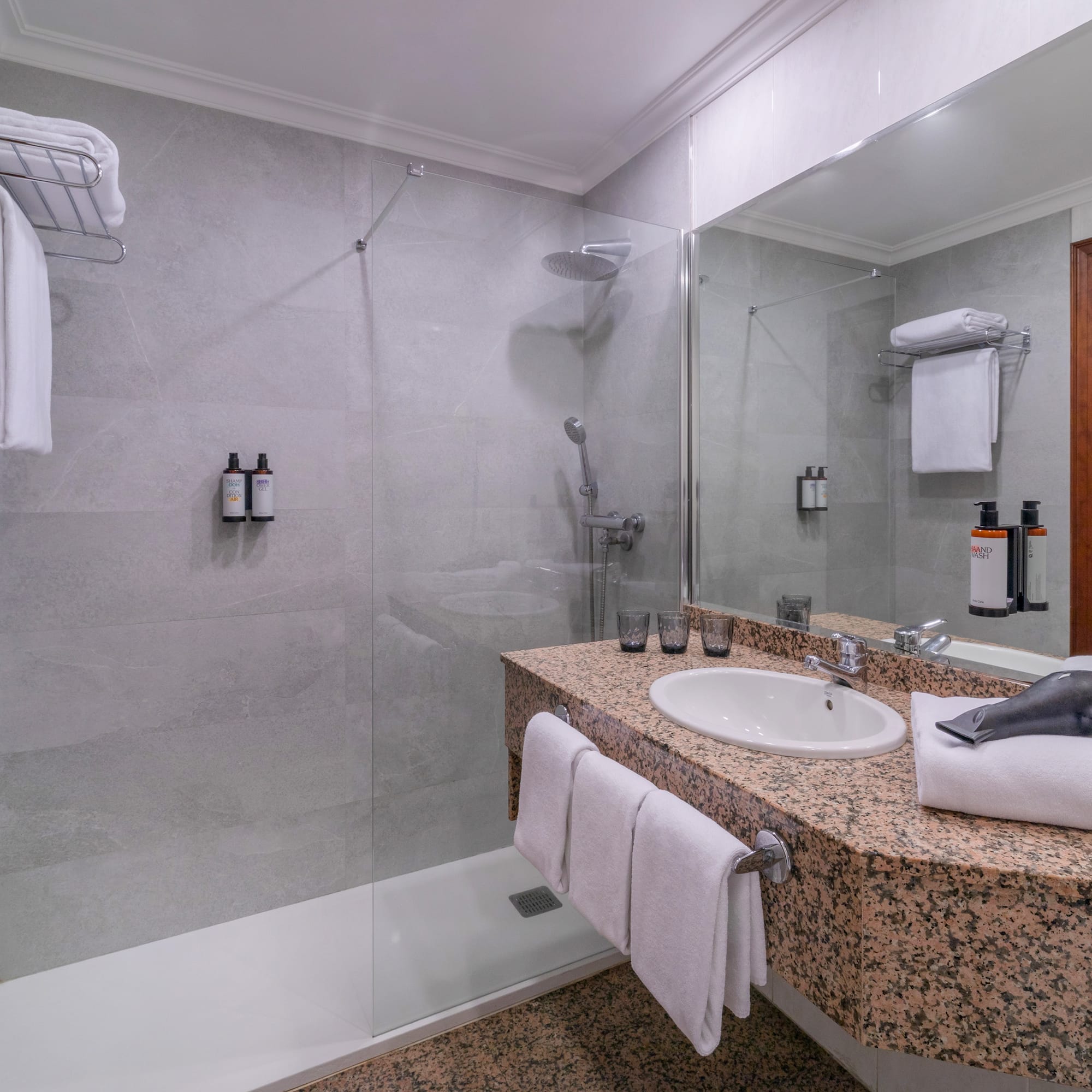 a bathroom with a shower and sink