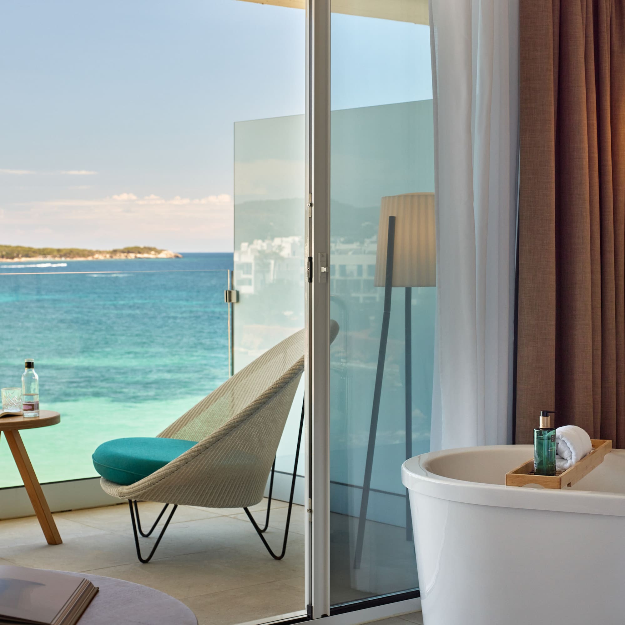 a room with a bathtub and a chair