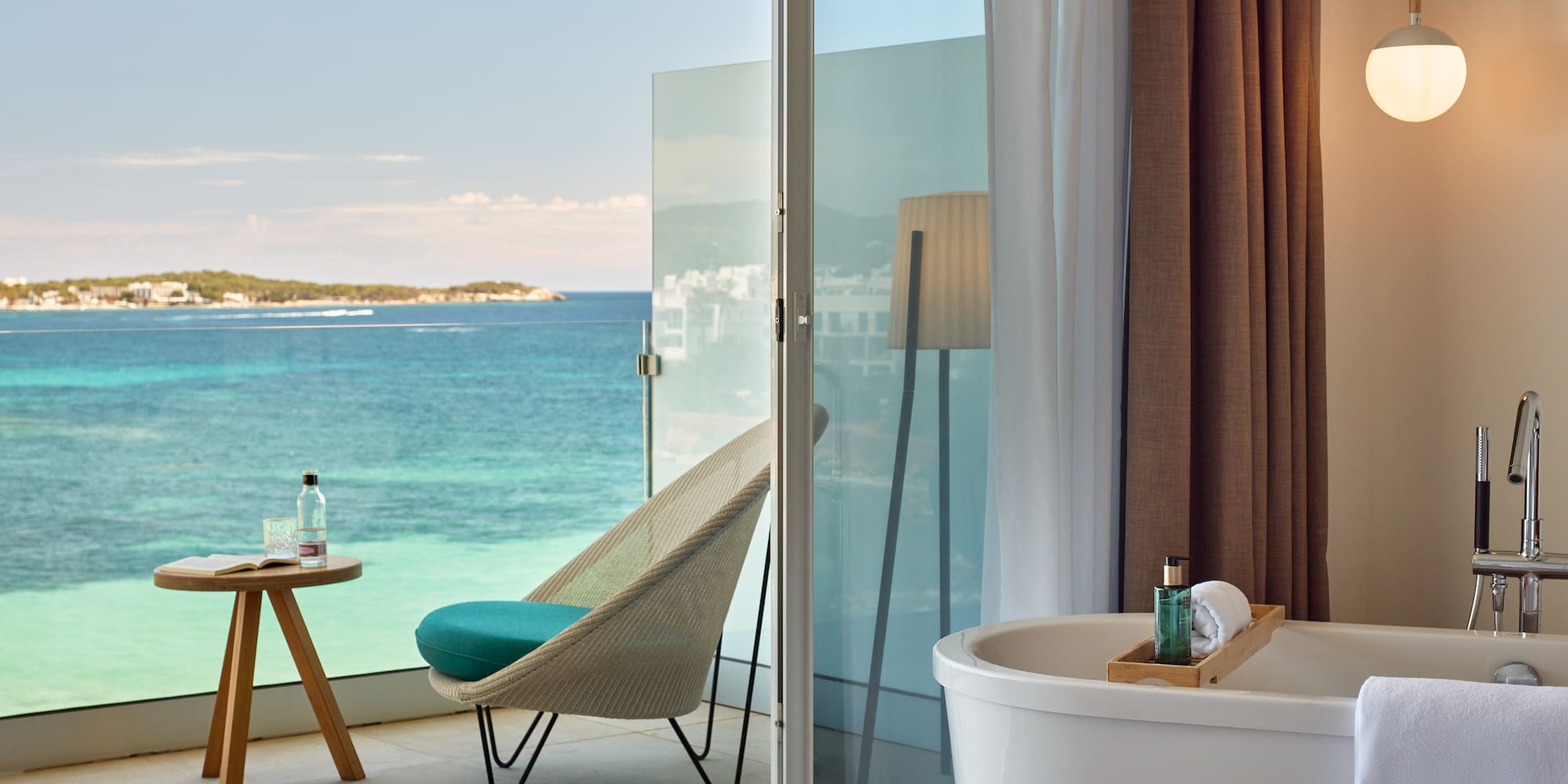 a room with a bathtub and a chair