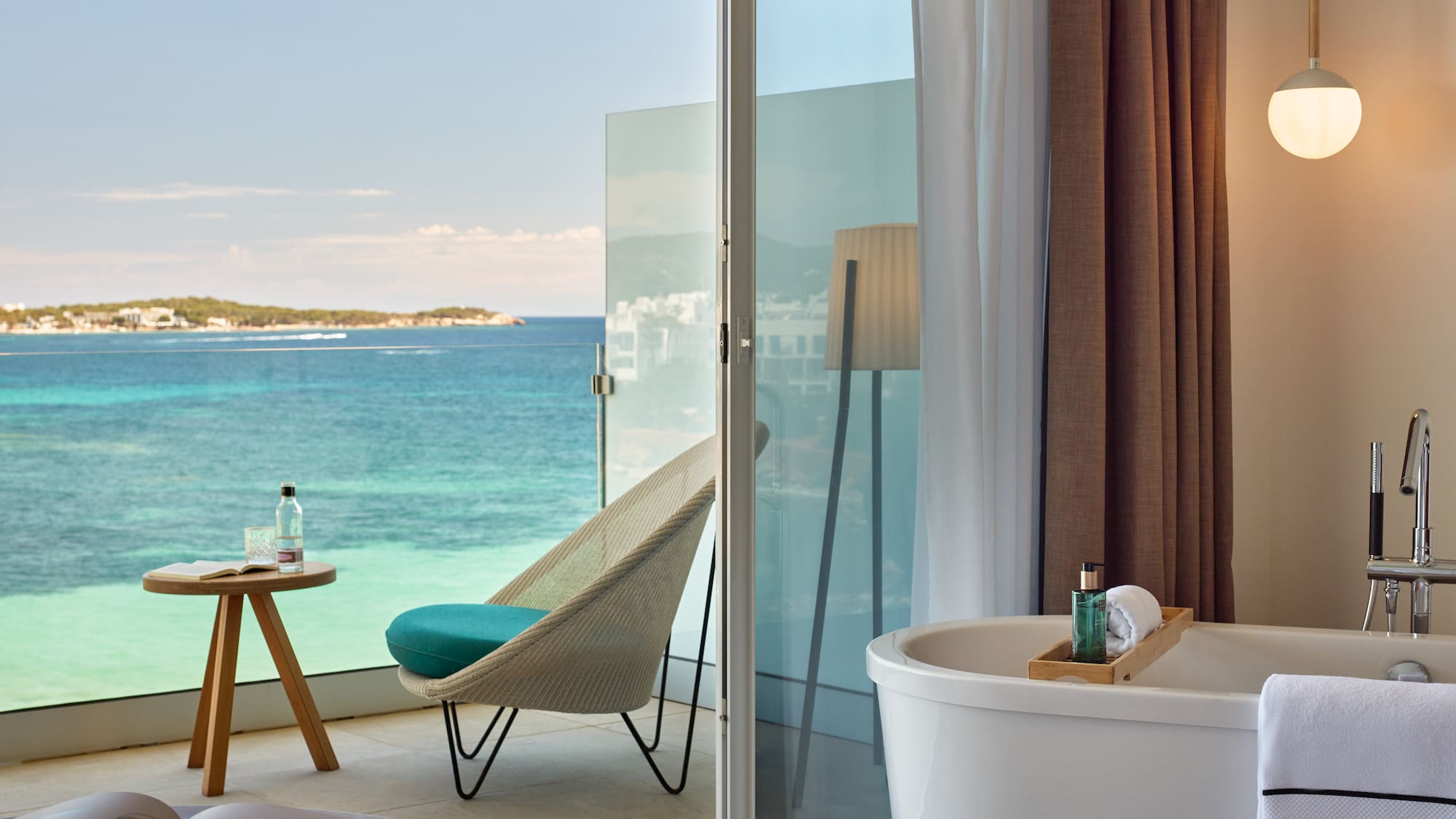 a room with a bathtub and a chair