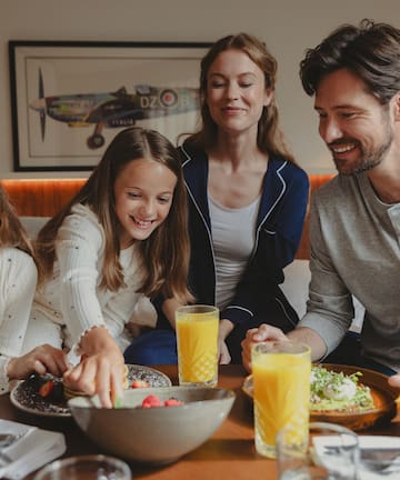a group of people sitting around a table