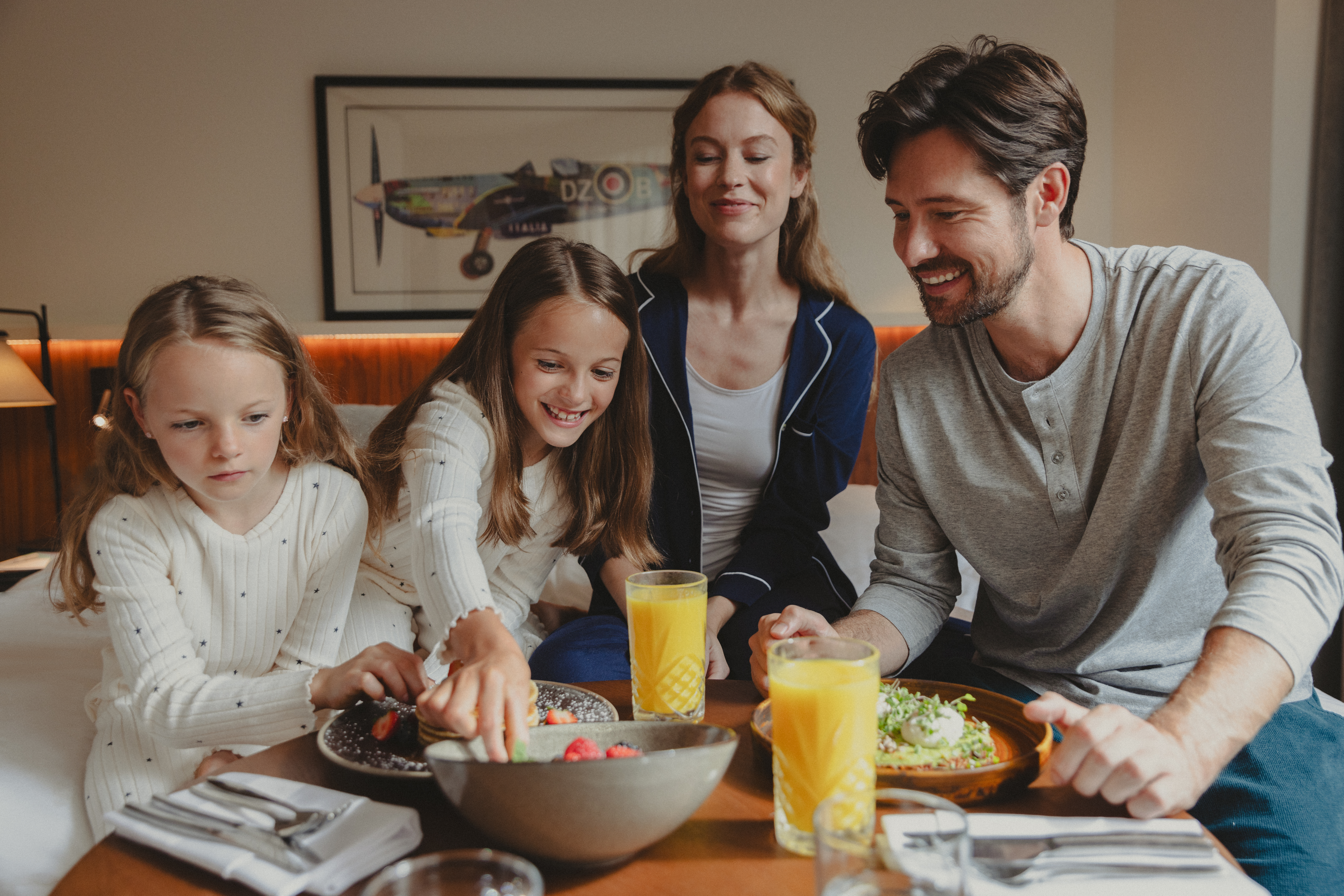 a group of people sitting around a table