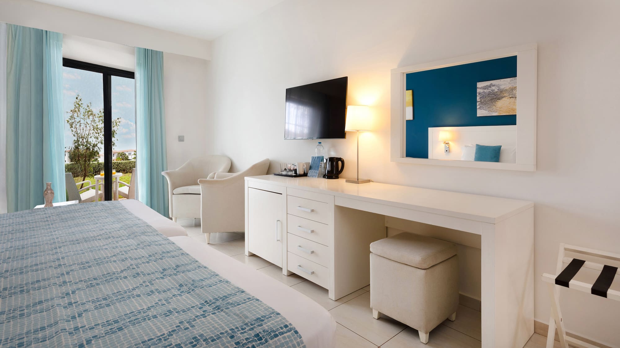 a room with a bed and a television