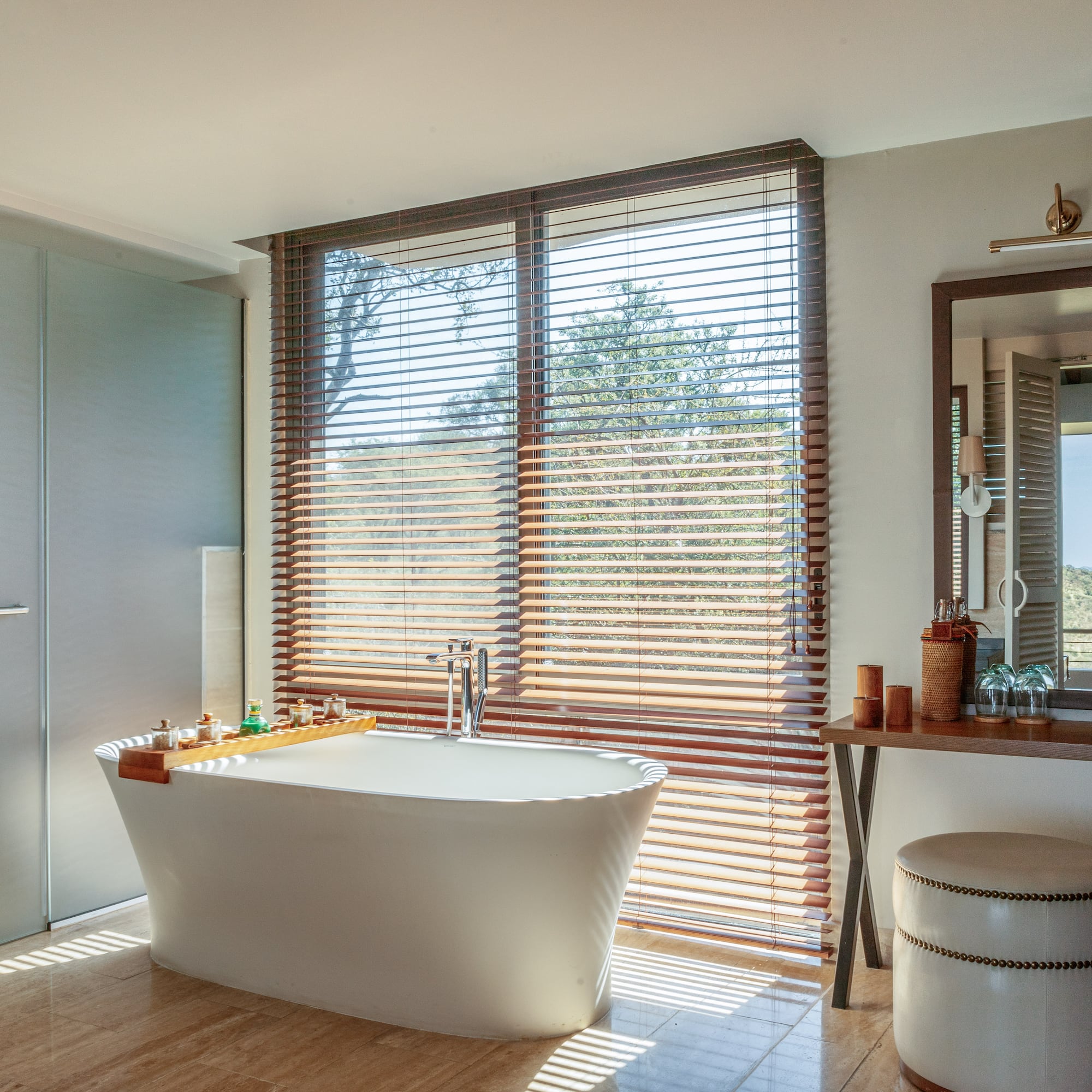 a bathroom with a tub and a mirror
