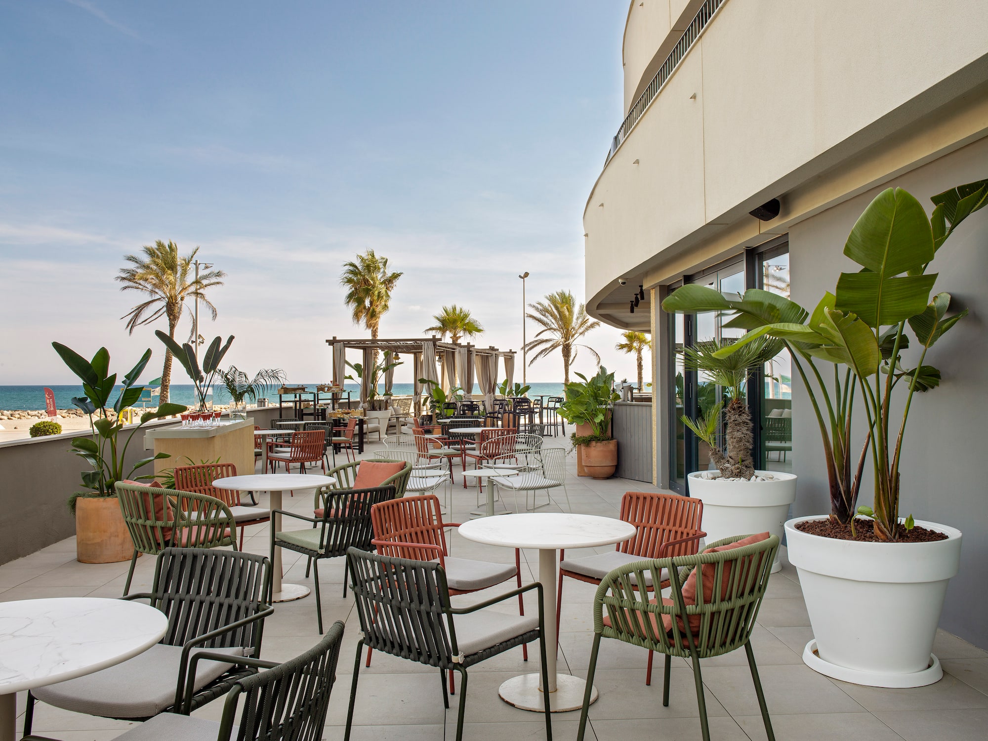 a patio with tables and chairs