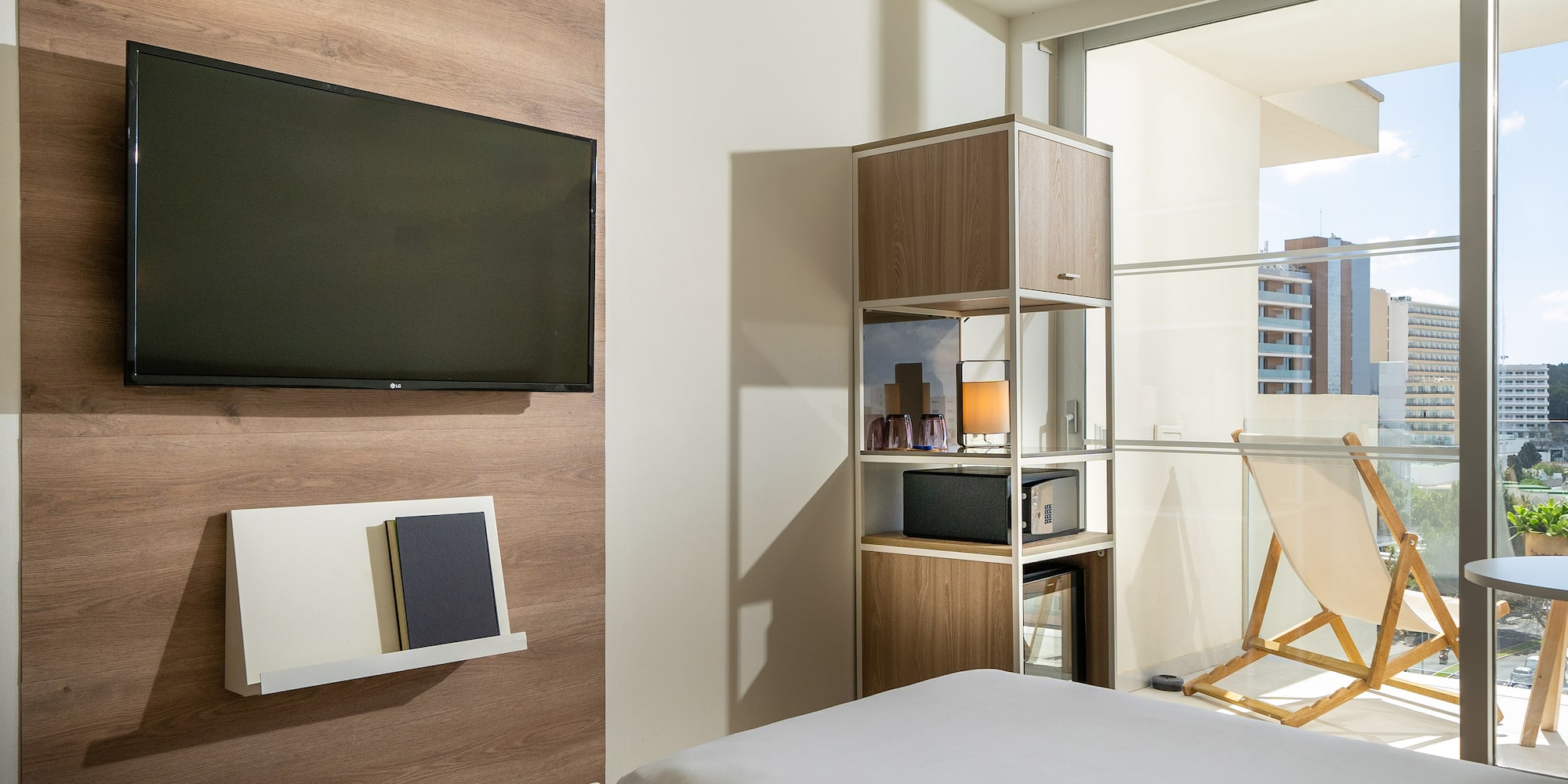 a room with a tv and a bed