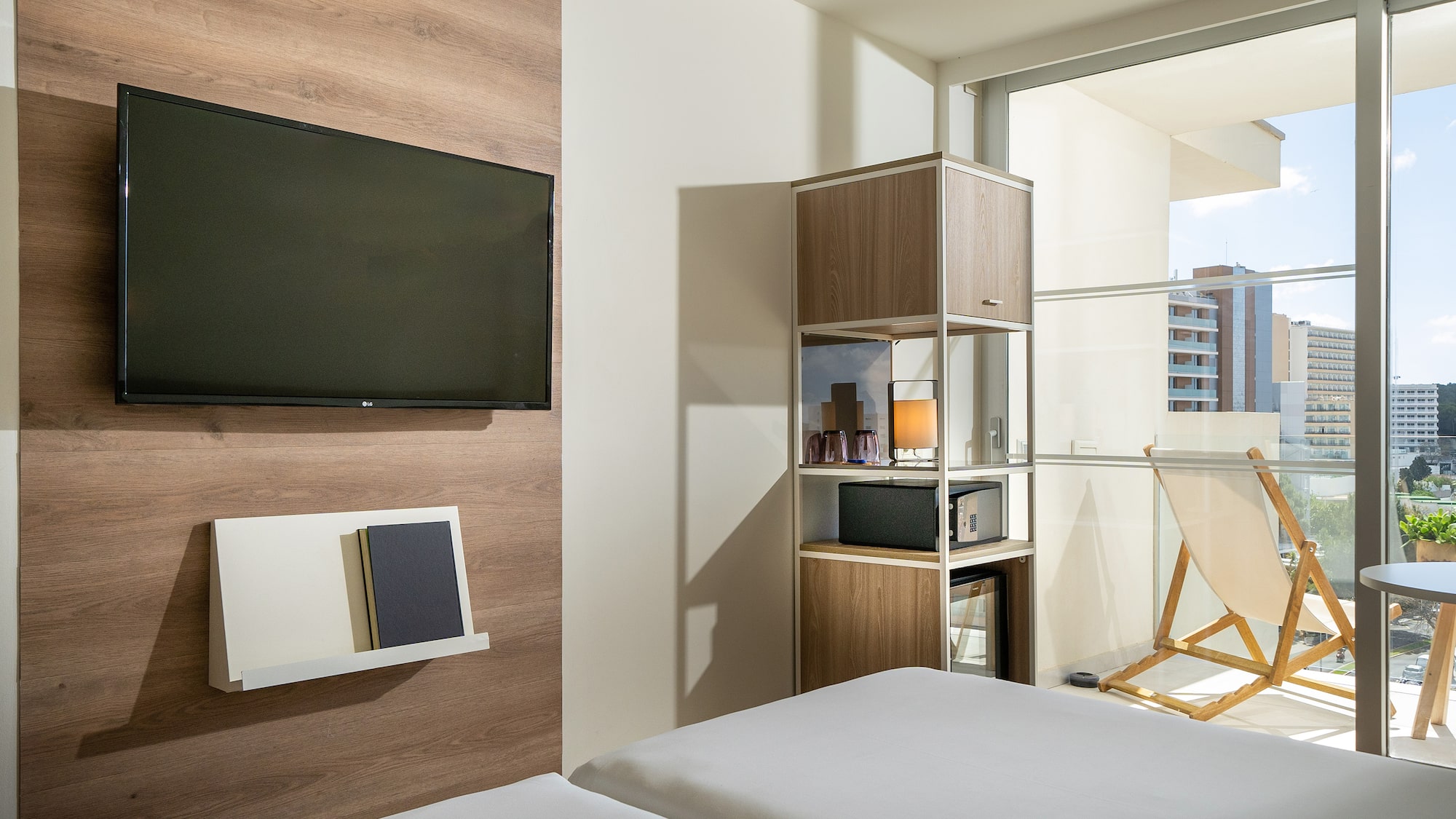 a room with a tv and a bed