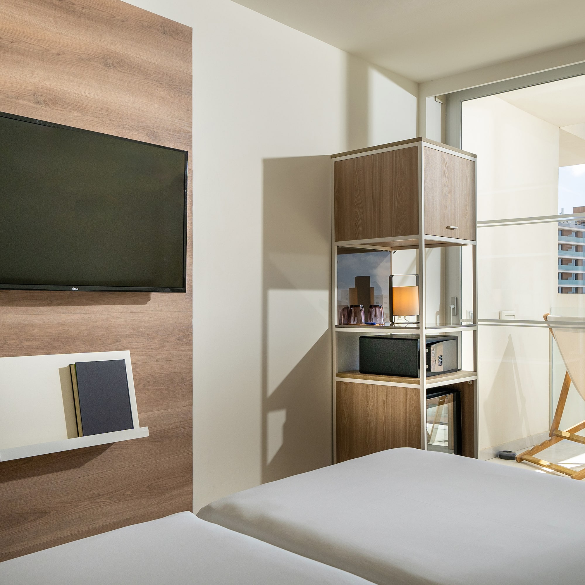 a room with a tv and a bed