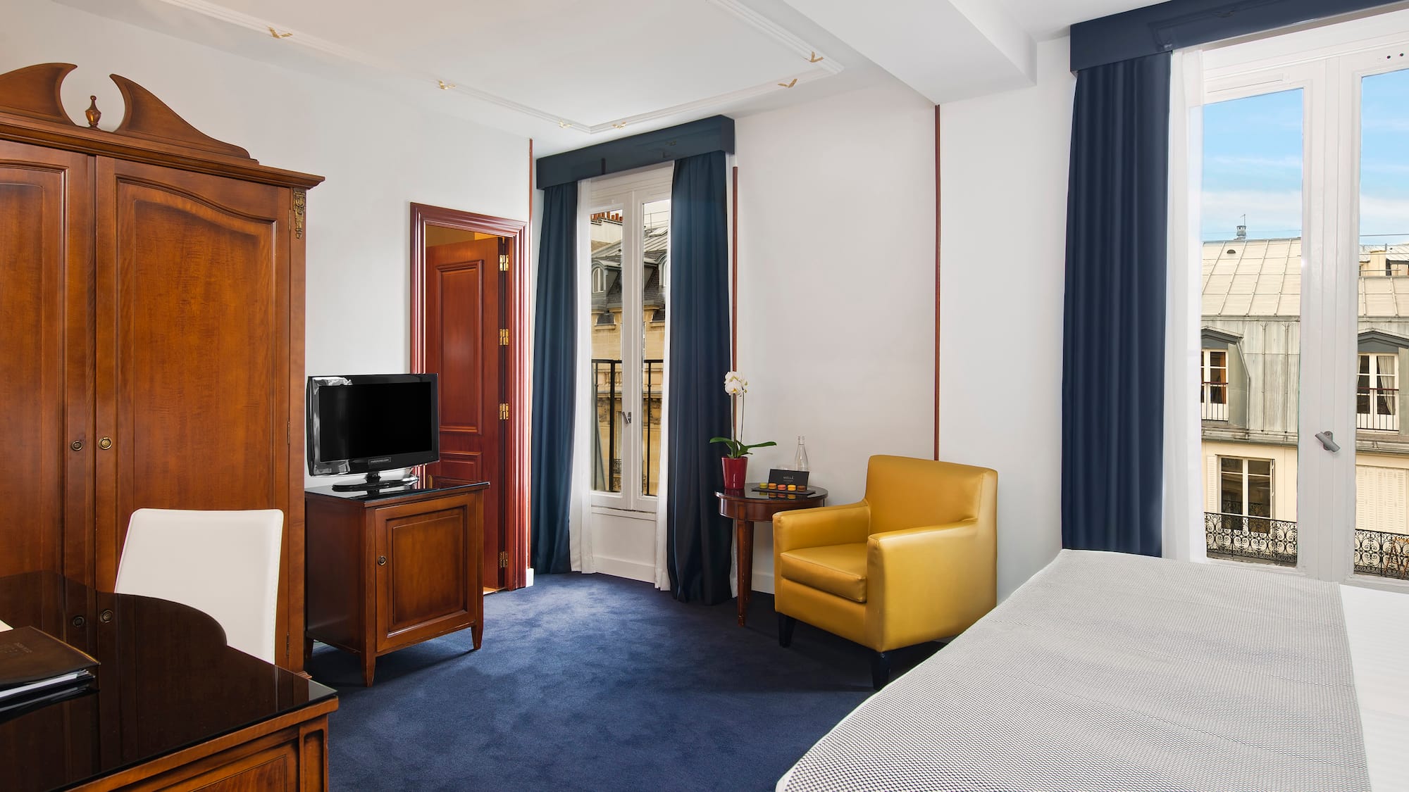 a room with a bed and a tv