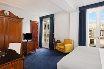 a room with a bed and a tv