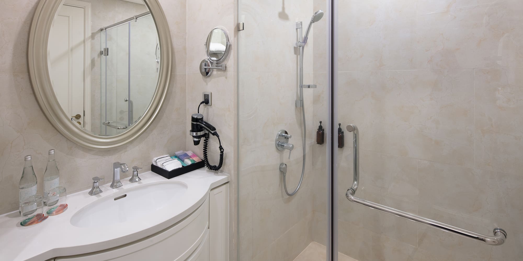 a bathroom with a shower and a sink