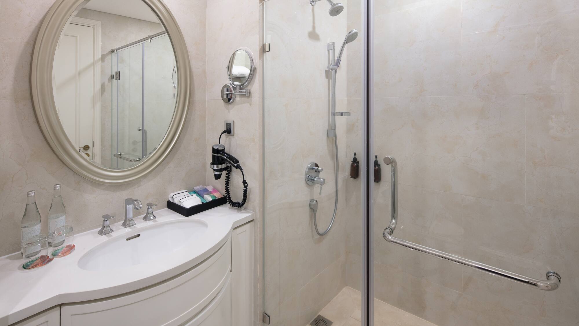 a bathroom with a shower and a sink