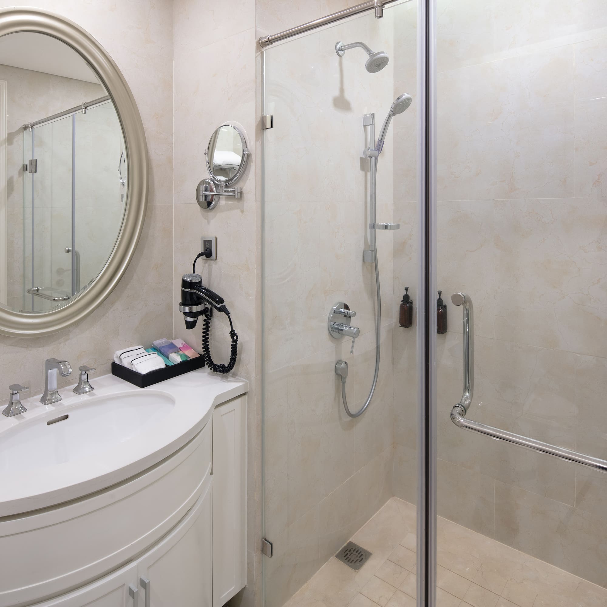 a bathroom with a shower and a sink