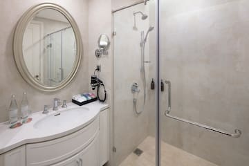 a bathroom with a shower and a sink