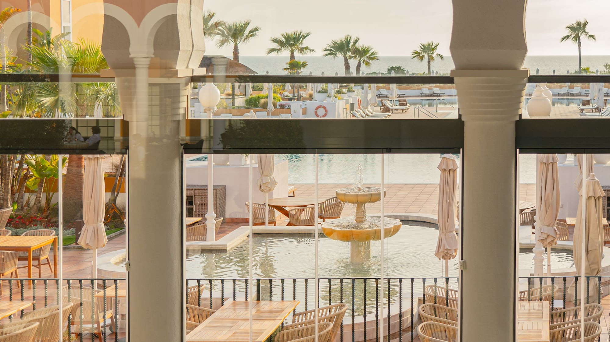 a view of a pool from a restaurant