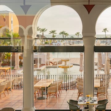 a view of a pool from a restaurant