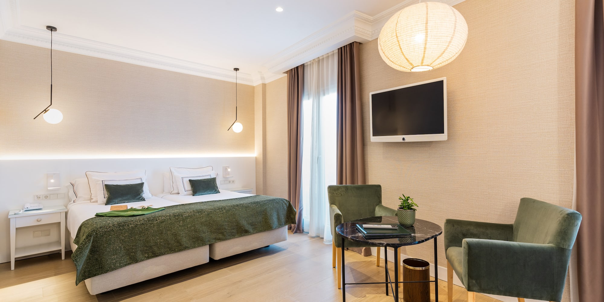 a room with a bed and chairs