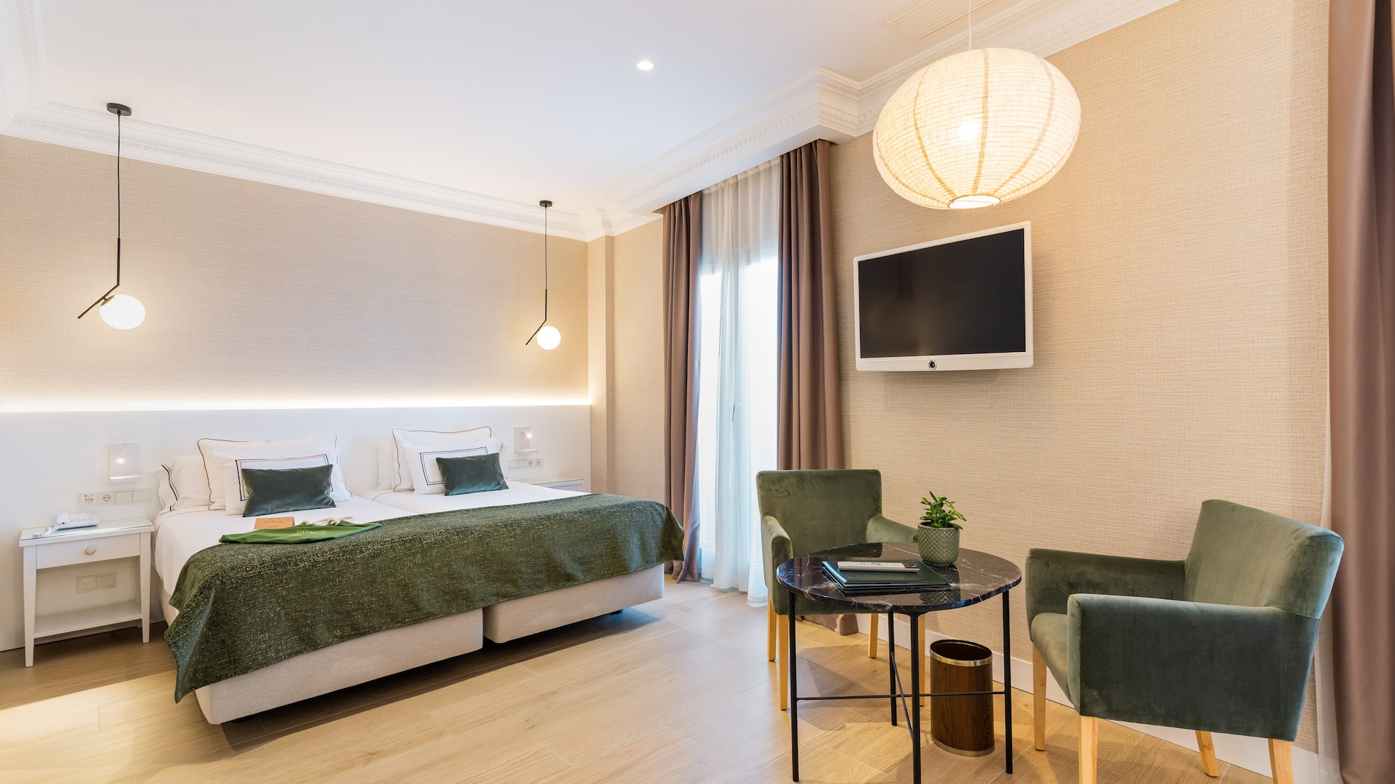 a room with a bed and chairs