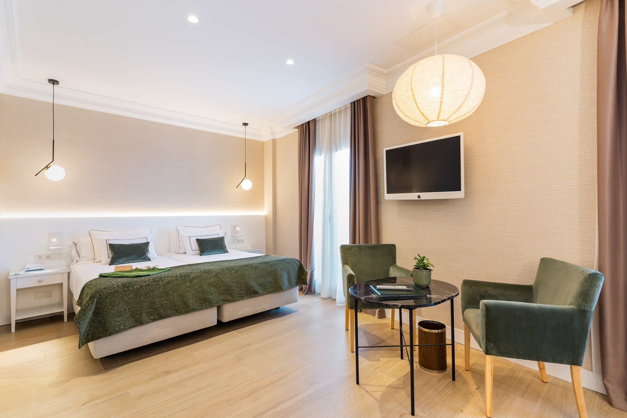 a room with a bed and chairs