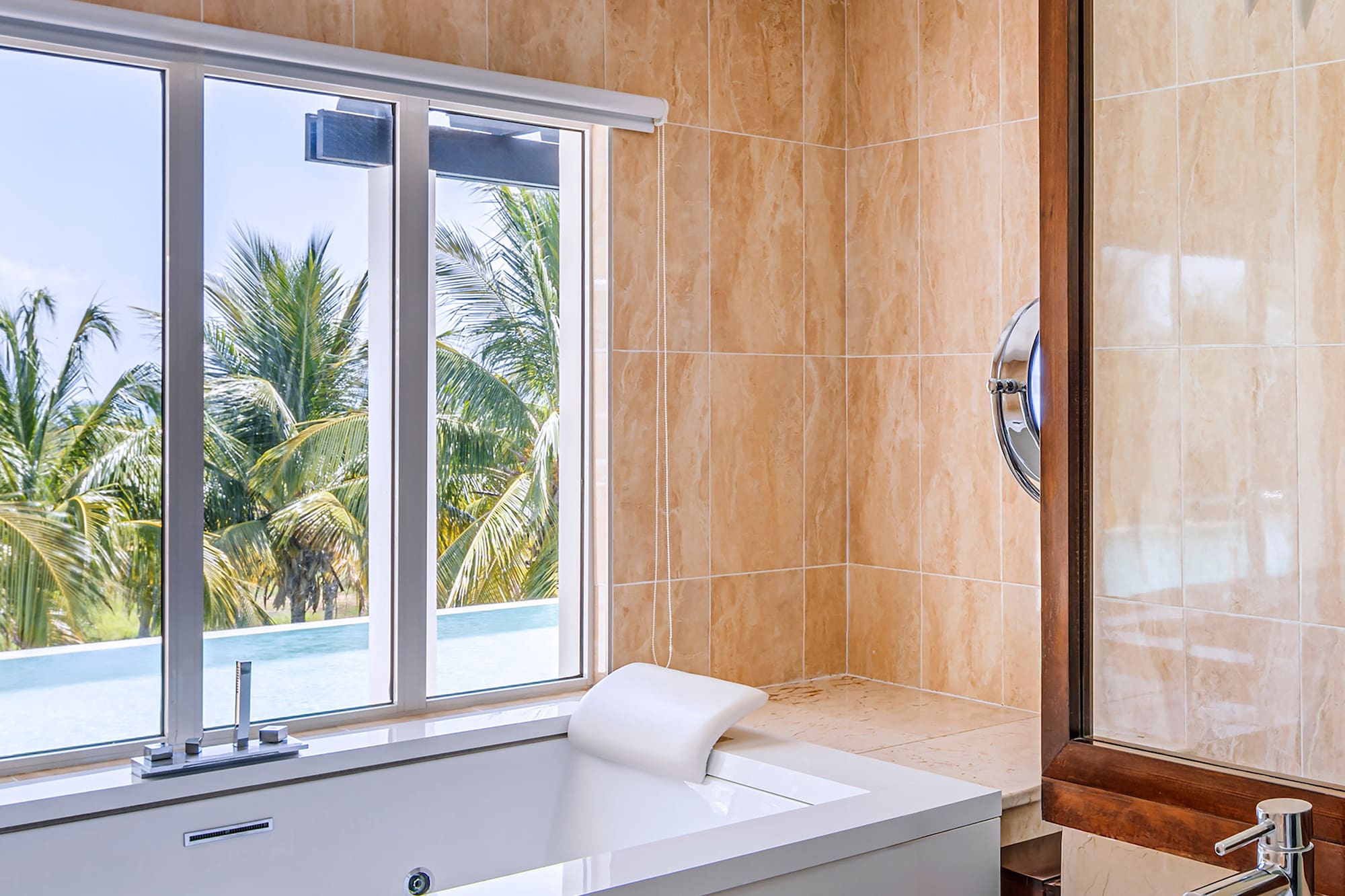 a bathroom with a tub sink and a window