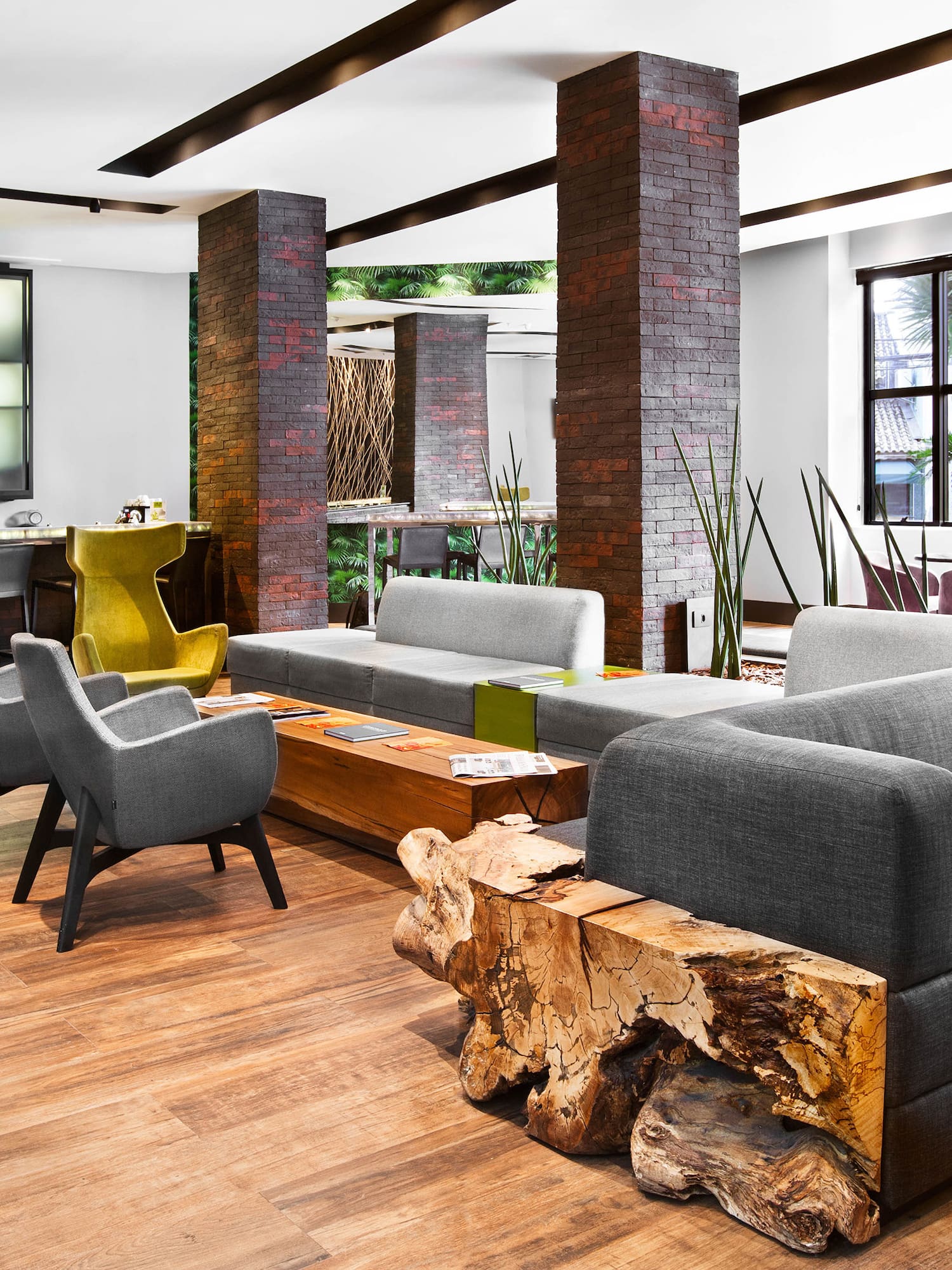 a room with a couch and chairs