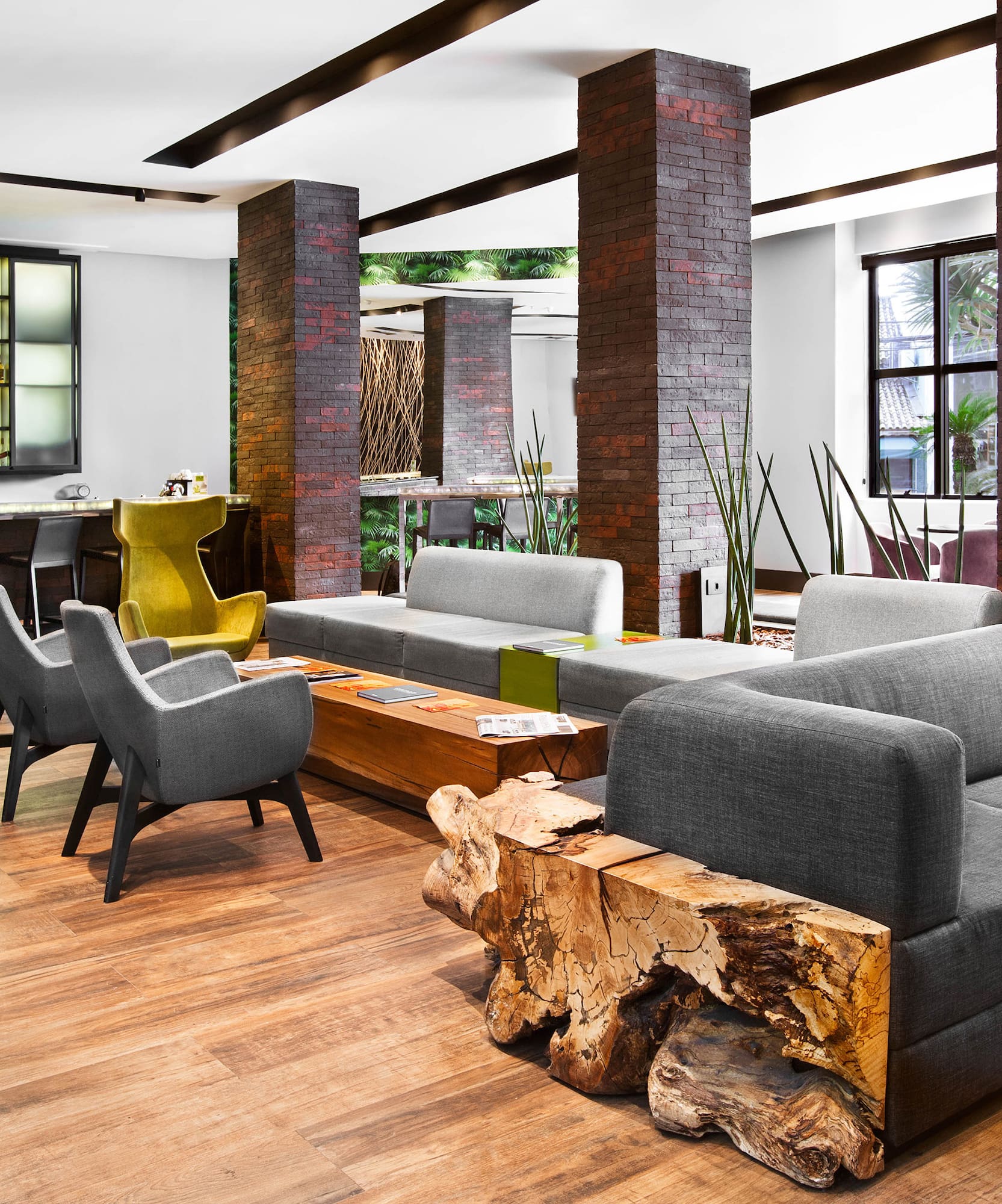 a room with a couch and chairs