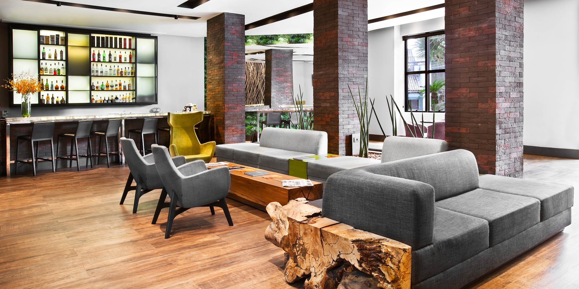 a room with a couch and chairs