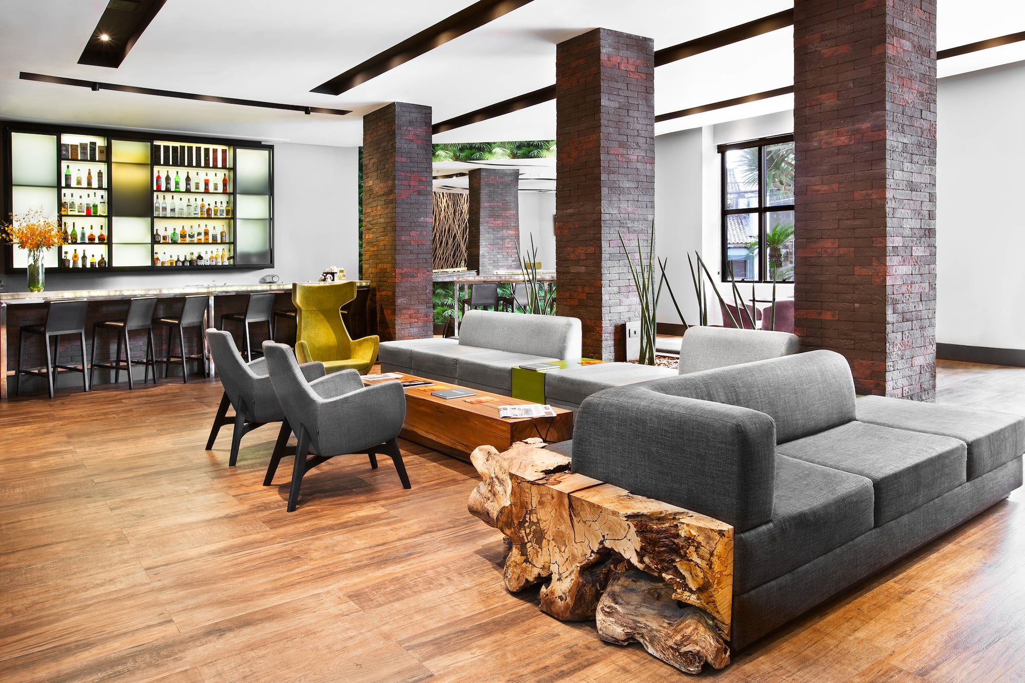 a room with a couch and chairs