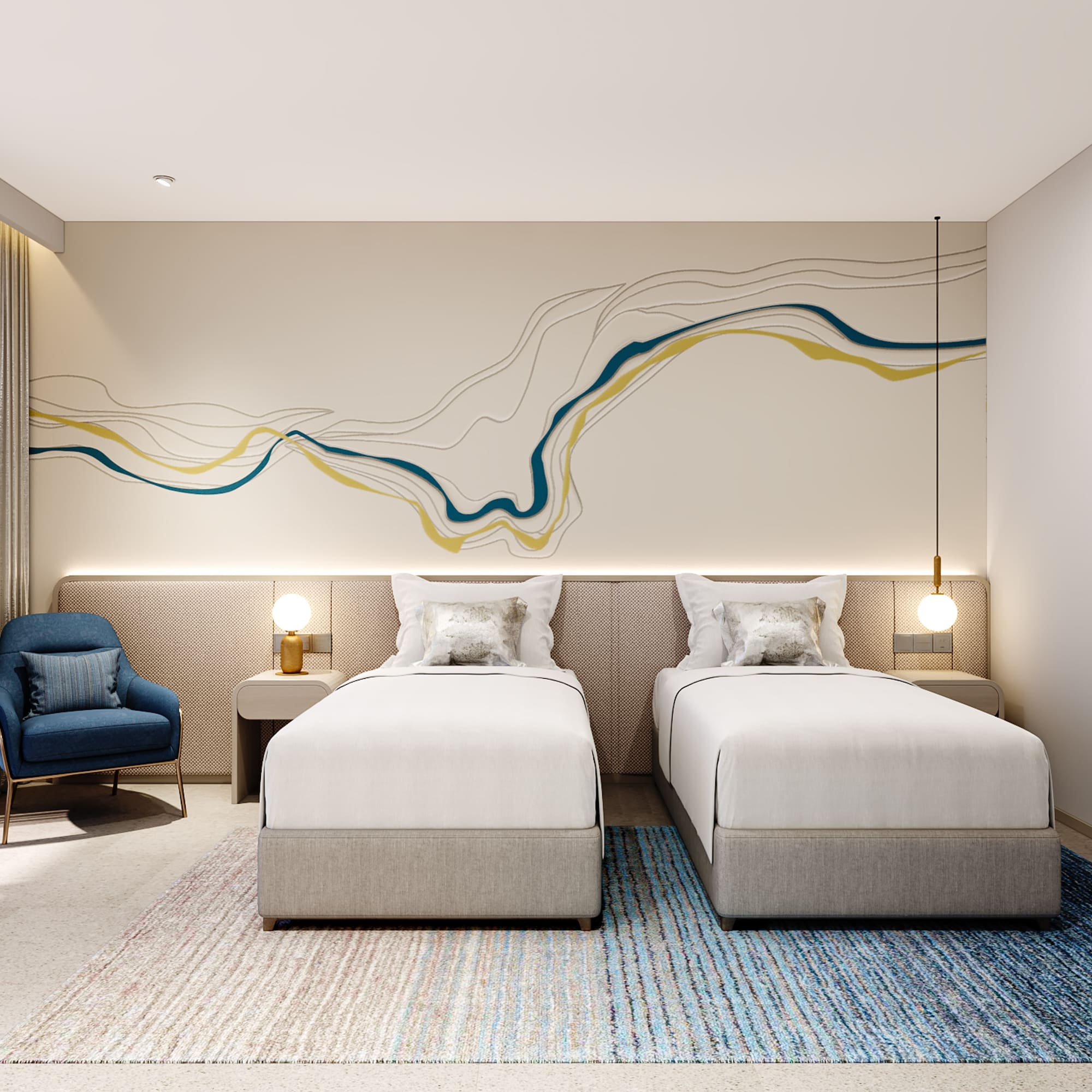 a room with two beds and a blue chair