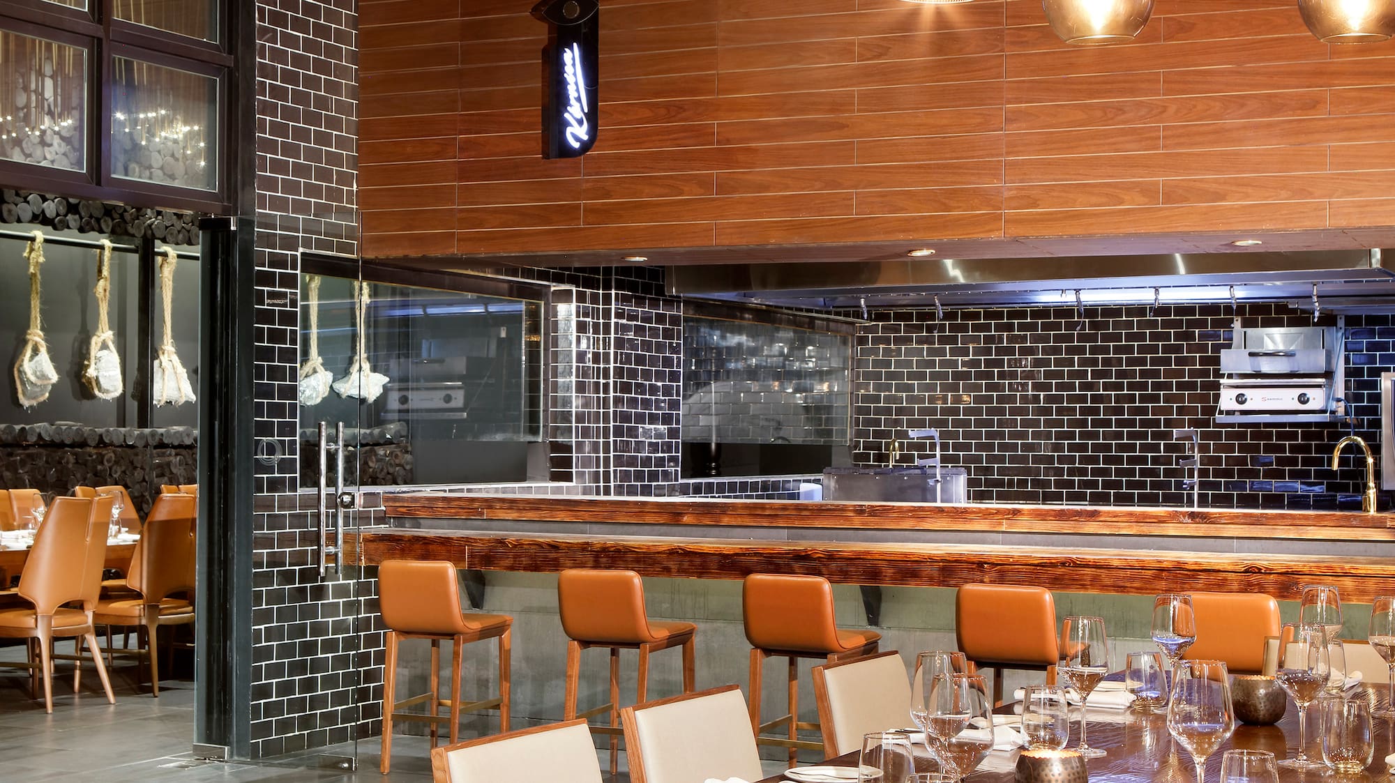 a restaurant with a large table and chairs