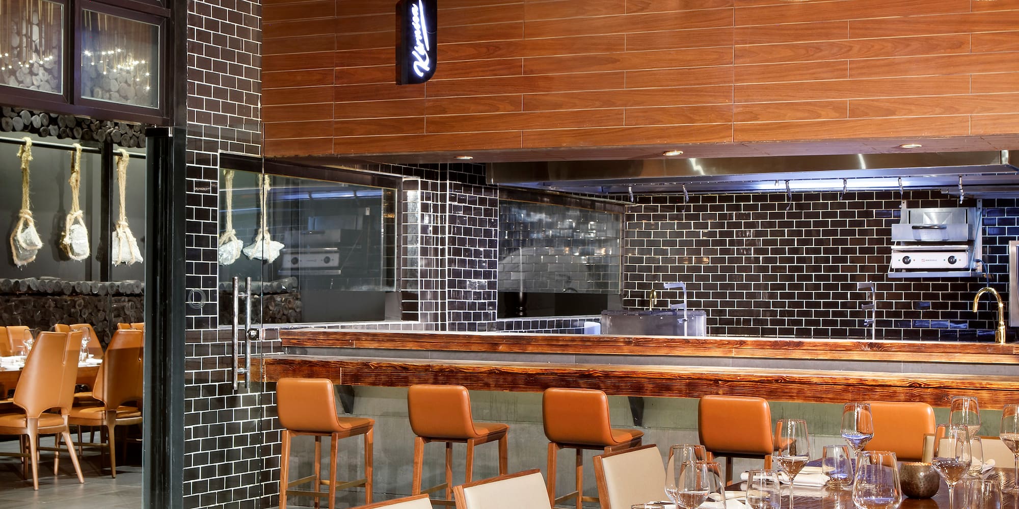 a restaurant with a large table and chairs