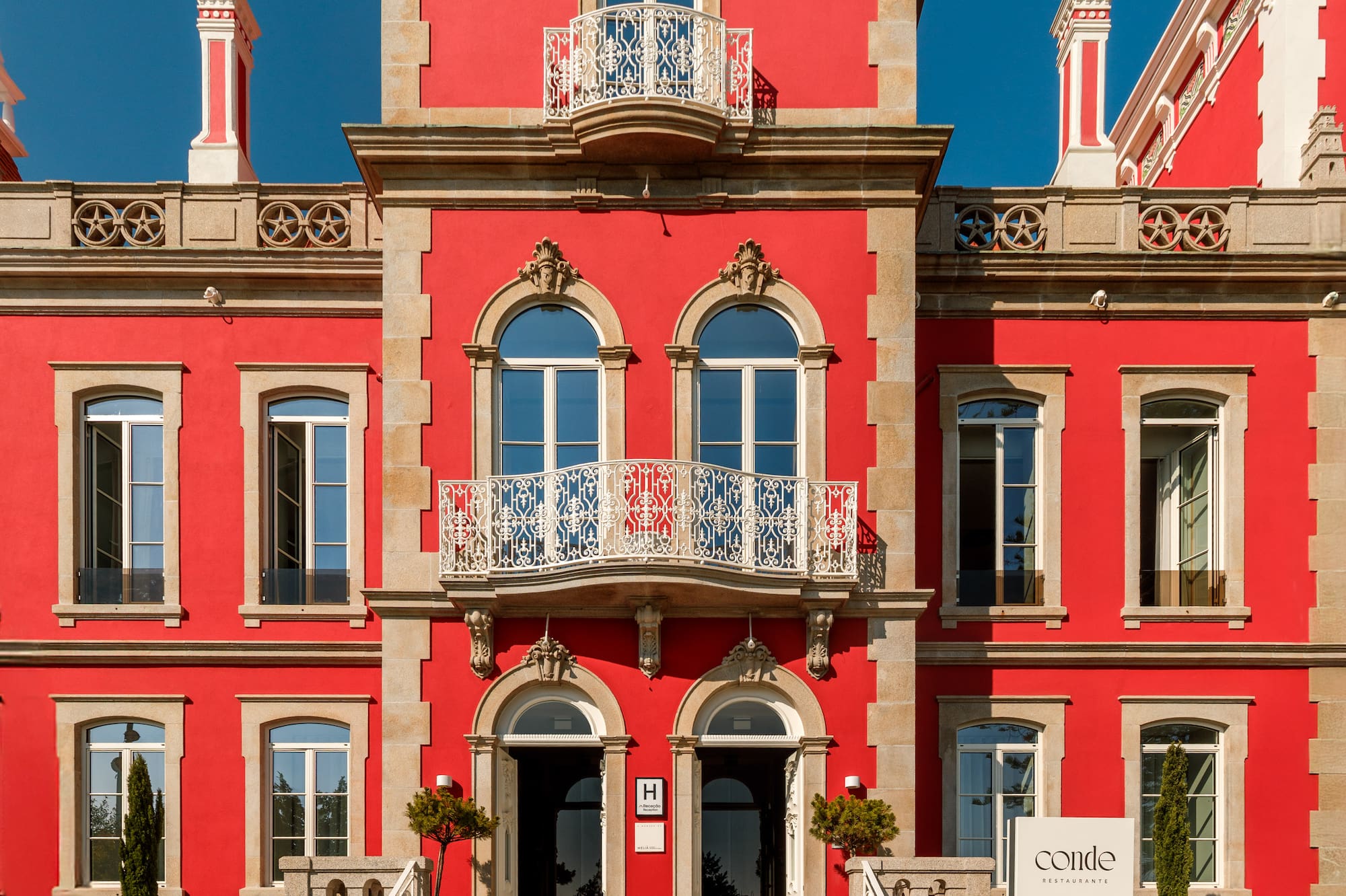a red building with a white sign