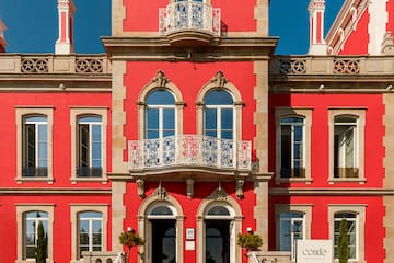 a red building with a white sign