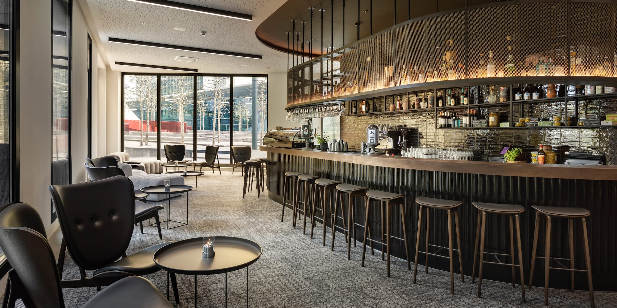 a bar with a counter and chairs
