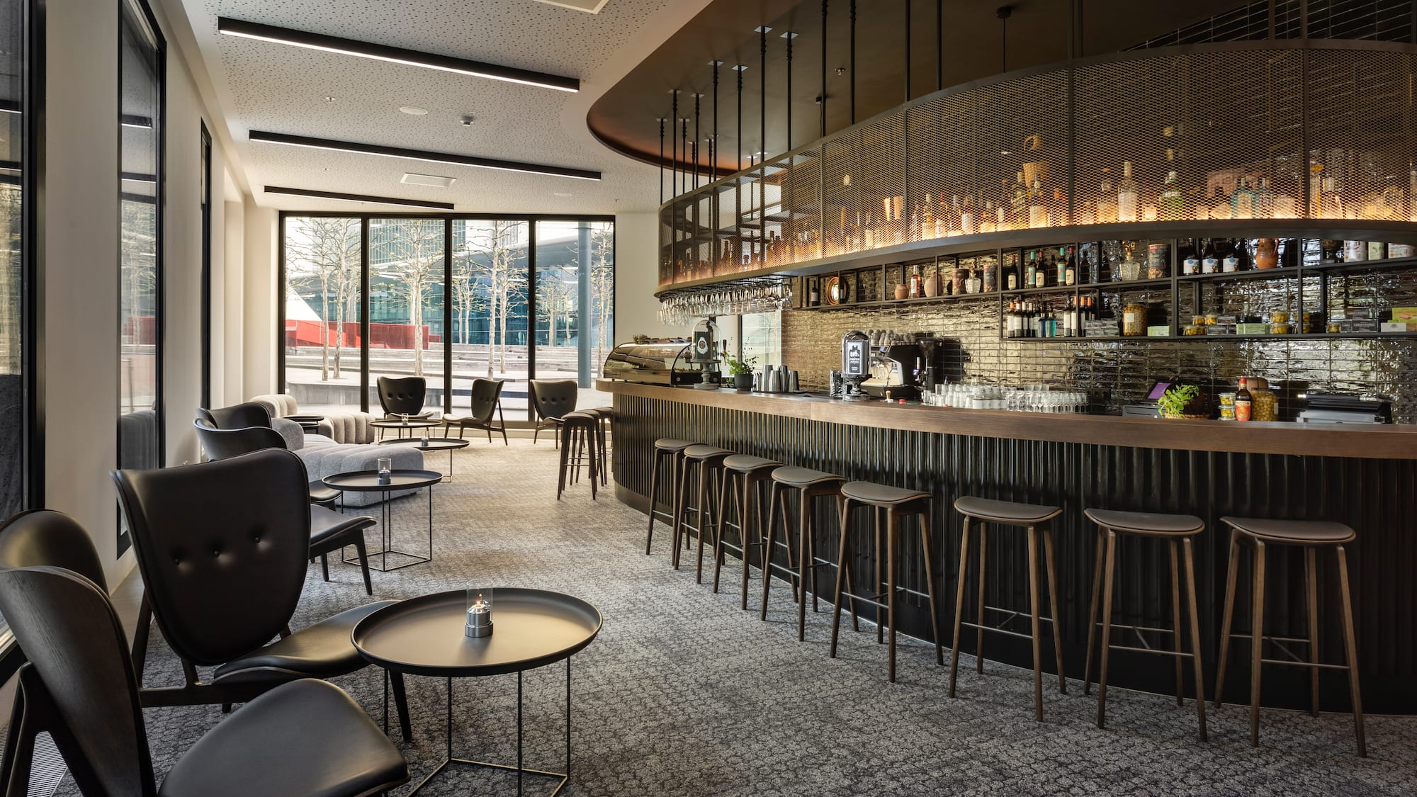 a bar with a counter and chairs