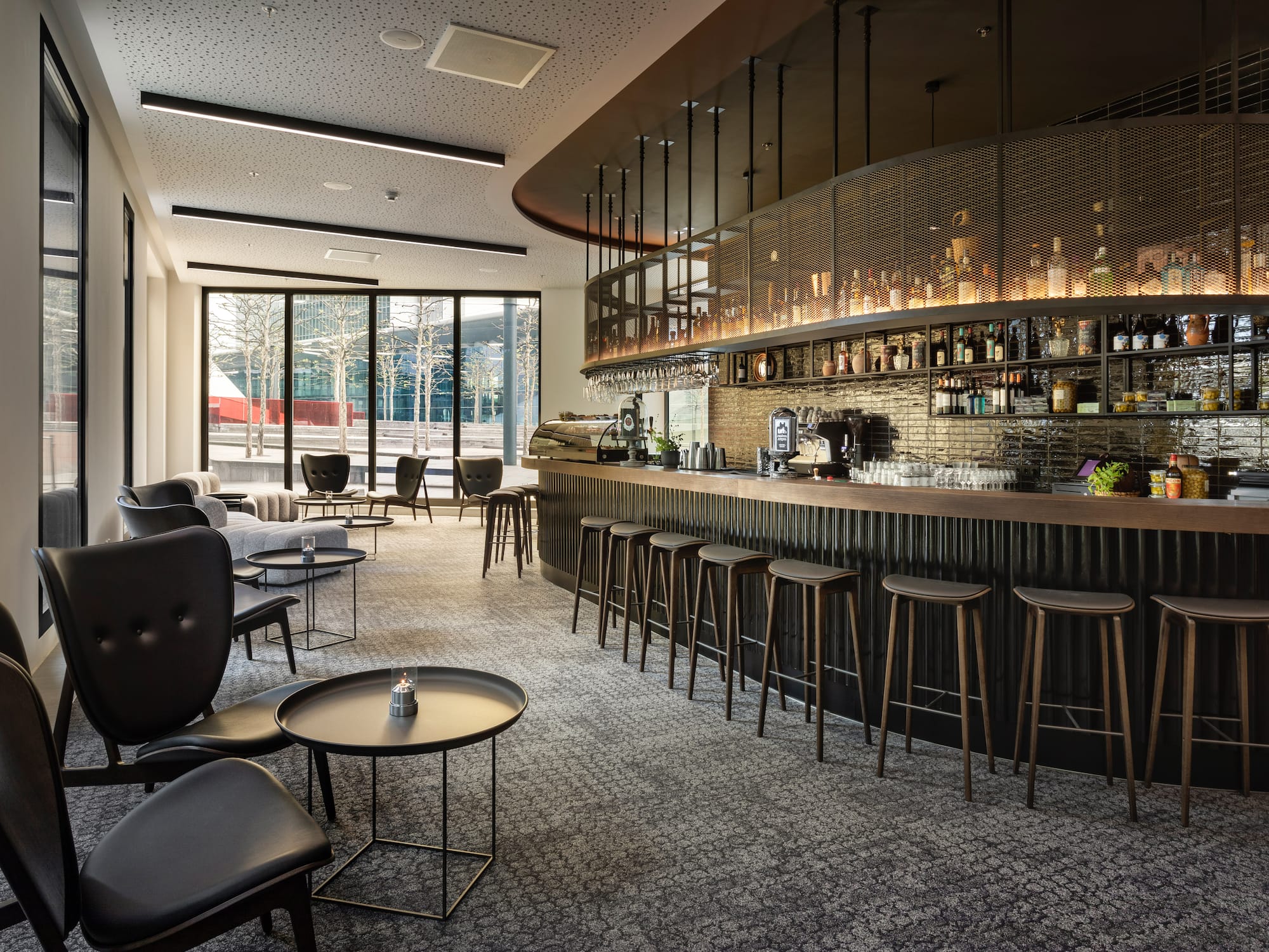 a bar with a counter and chairs