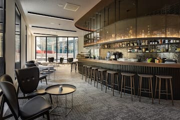 a bar with a counter and chairs