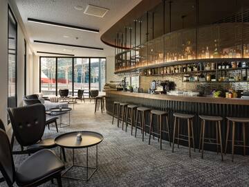 a bar with a counter and chairs