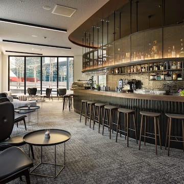 a bar with a counter and chairs