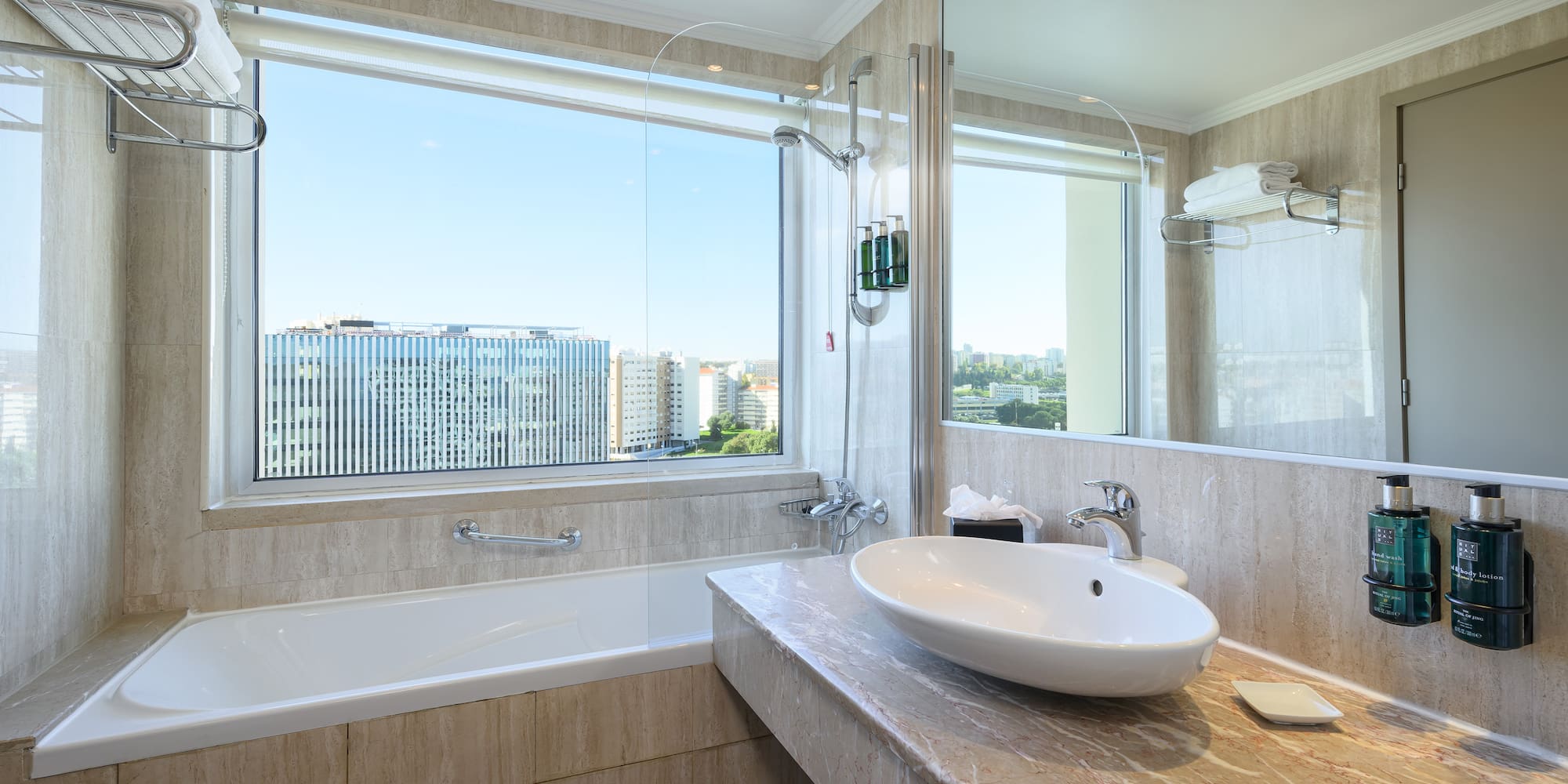 a bathroom with a large window and sink