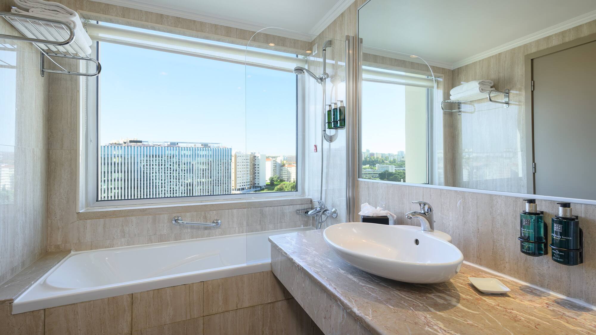 a bathroom with a large window and sink
