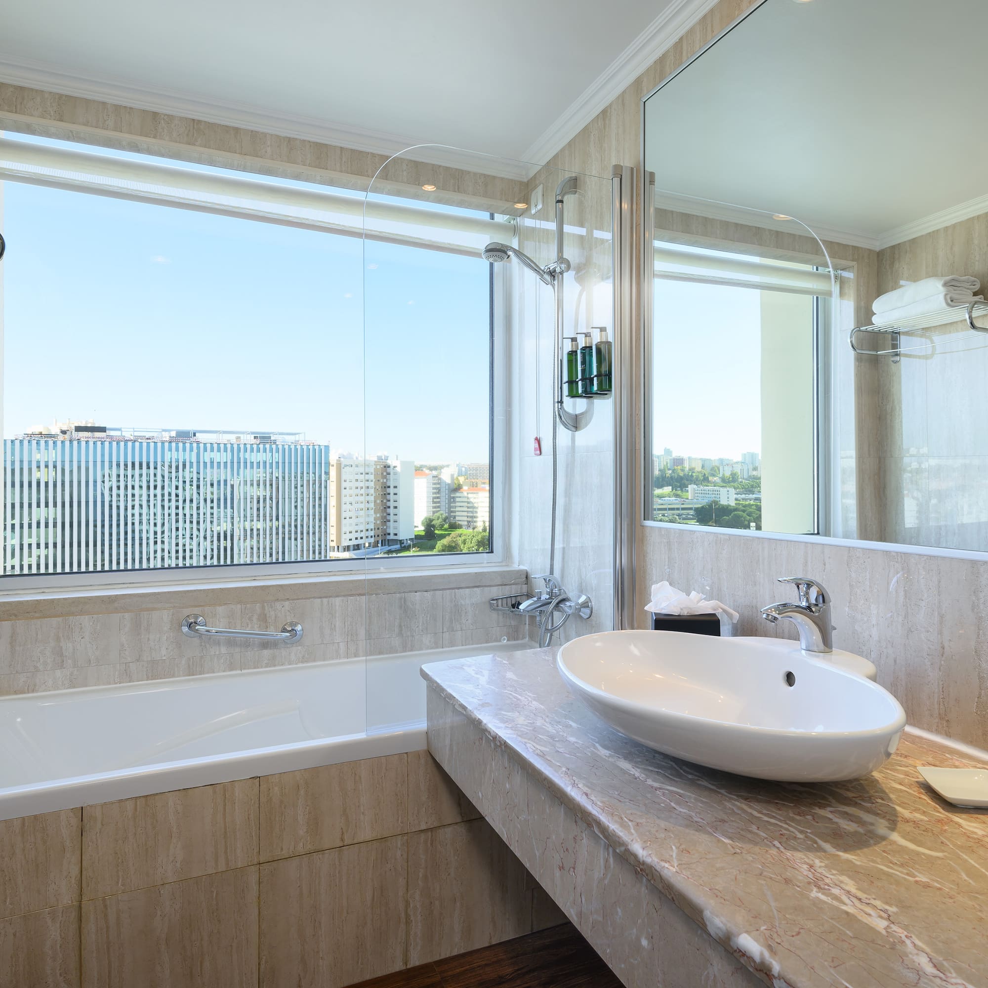 a bathroom with a large window and sink